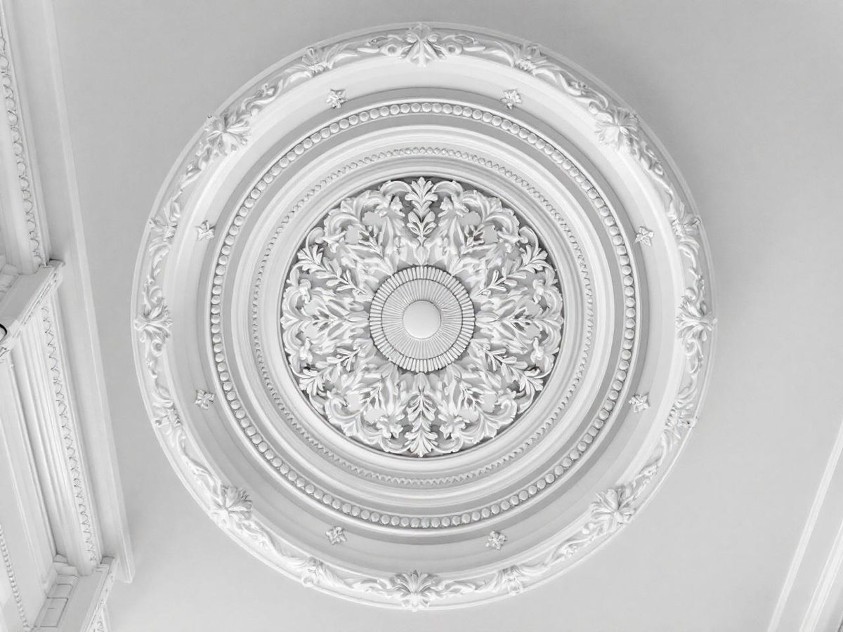 Professional ceiling painting detail showing clean finish around an ornate ceiling rose in an Essendon heritage home