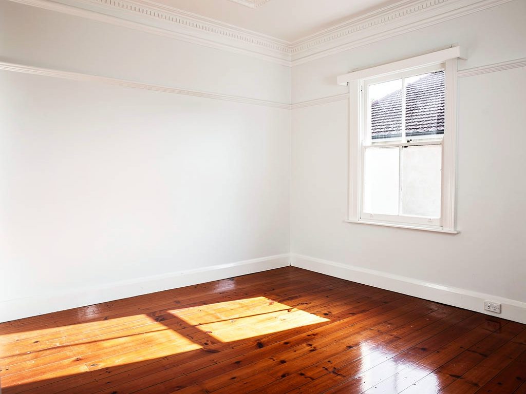 Close-up of weatherboard surface showing paint preparation on a Melbourne home